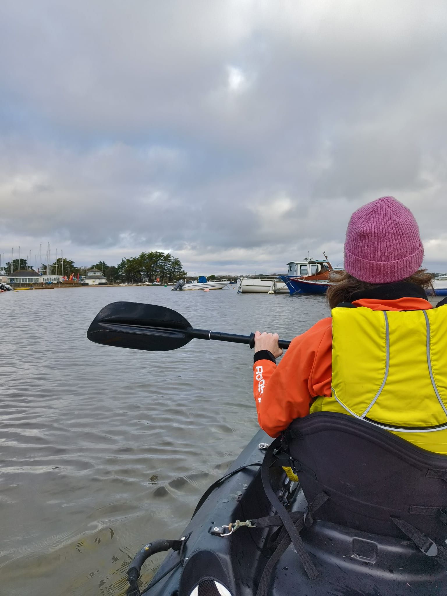 A guest kayaking through the waterways around Keyhaven