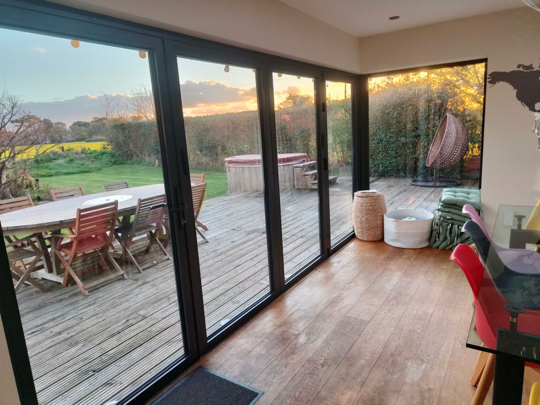 Warm outdoor hot tub and retreat space at sunset